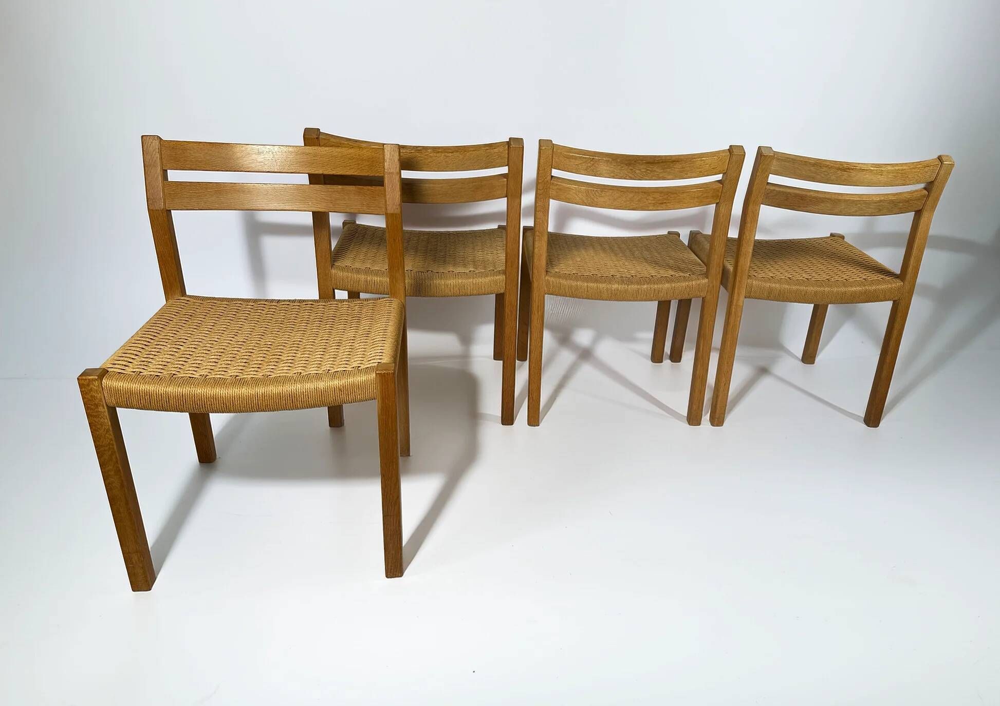 Dining chairs J.H. Møller model 401 in oak with original Danish cord — Denmark, 1970s