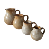 Lot of 4 pitchers in sandstone
