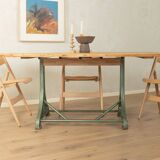 Unique dining table with cast iron base and solid wood top