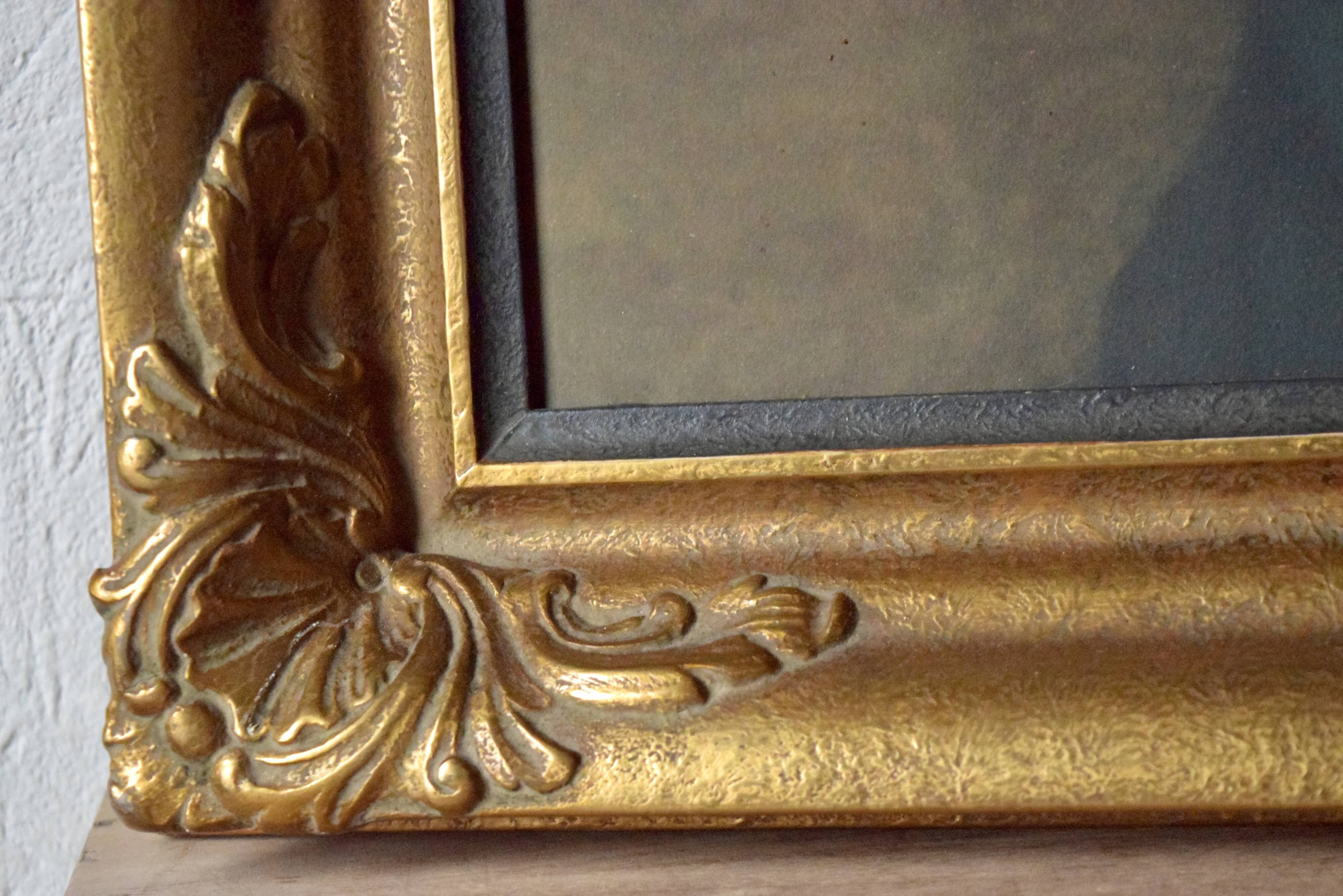 Old large wall frame in gilded carved wood