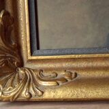 Old large wall frame in gilded carved wood