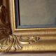 Old large wall frame in gilded carved wood