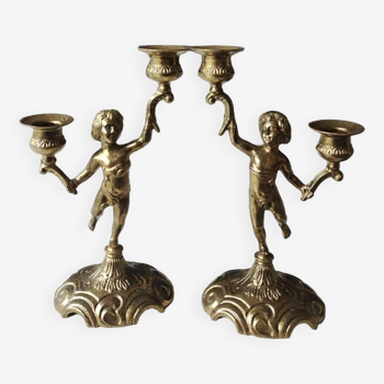 Pair of Candlesticks with 2 arms of light. Cherub/Putti decoration in solid brass. Art Deco period.