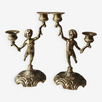 Paire de chandeliers à 2 bras de lumière décor chérubin/putti en laiton massif période art déco