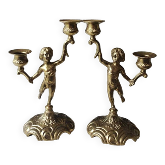 Pair of Candlesticks with 2 arms of light. Cherub/Putti decoration in solid brass. Art Deco period.