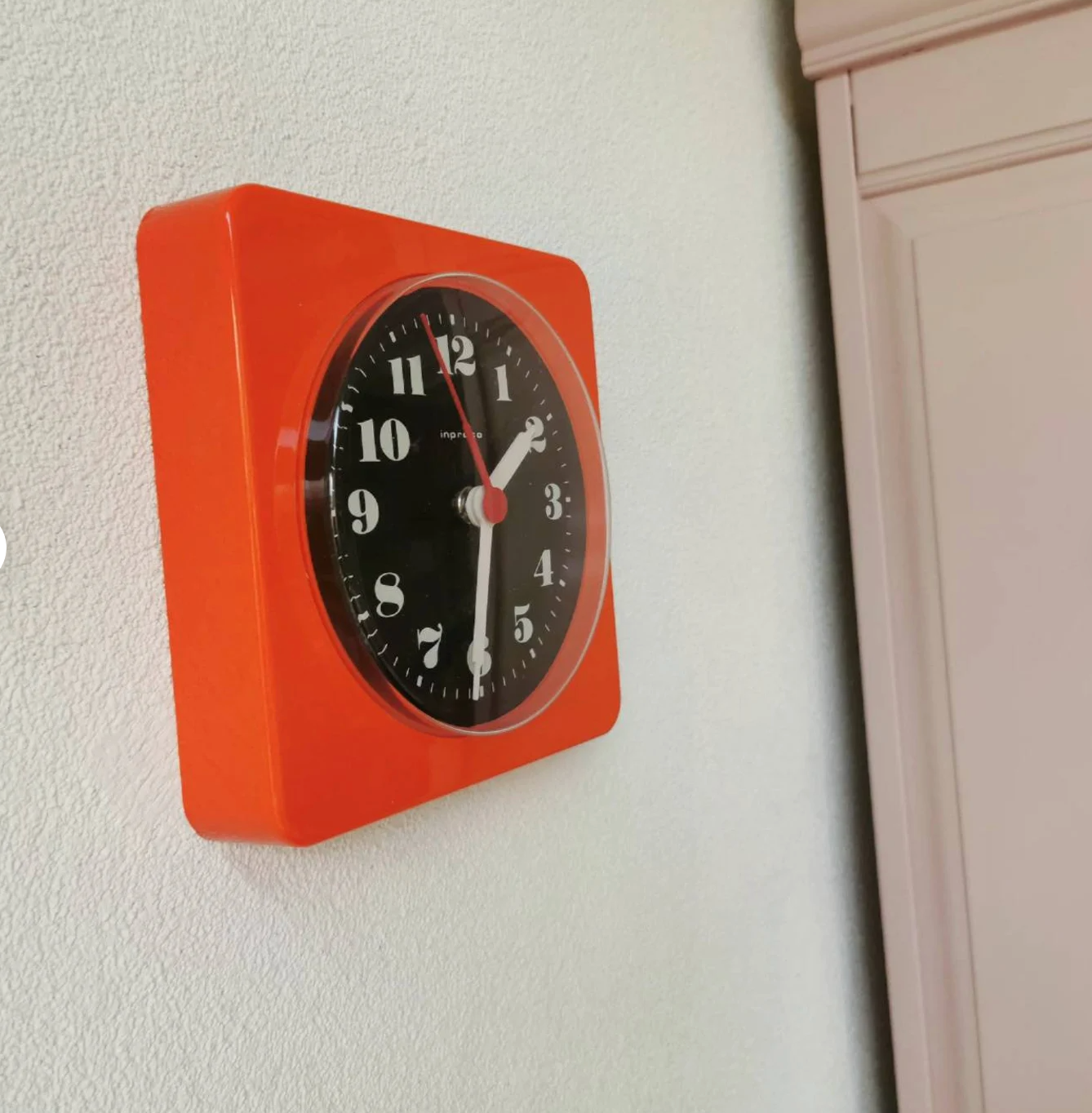 Vintage orange wall clock made of Inproco plastic, 1970