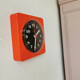 Vintage orange wall clock made of Inproco plastic, 1970