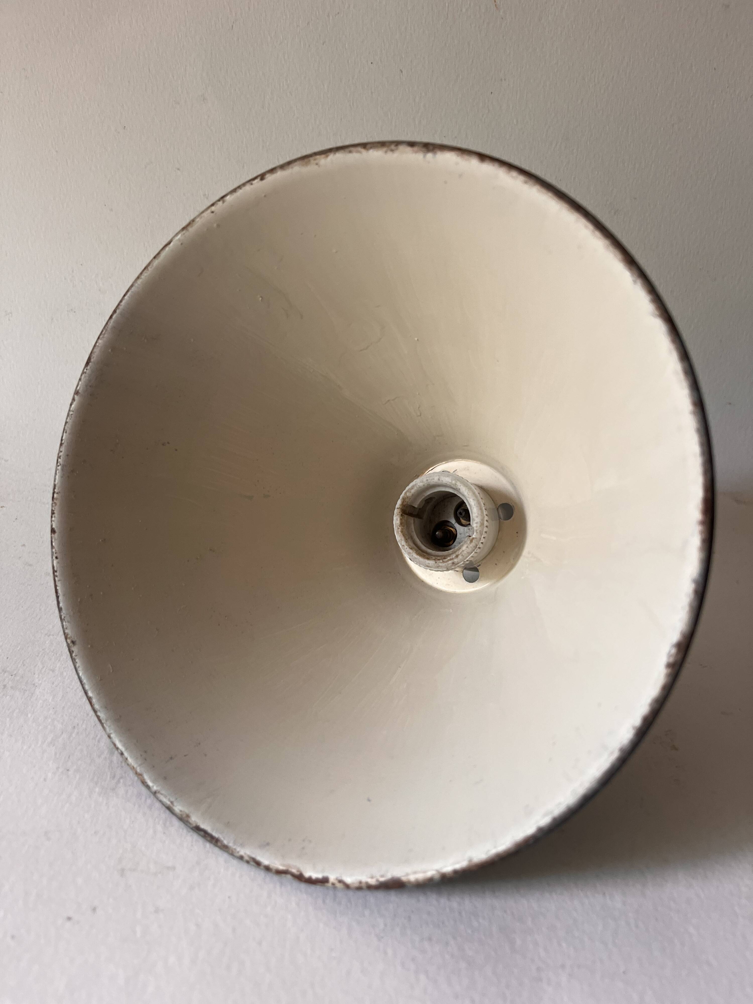 Conical wall light on porcelain base
