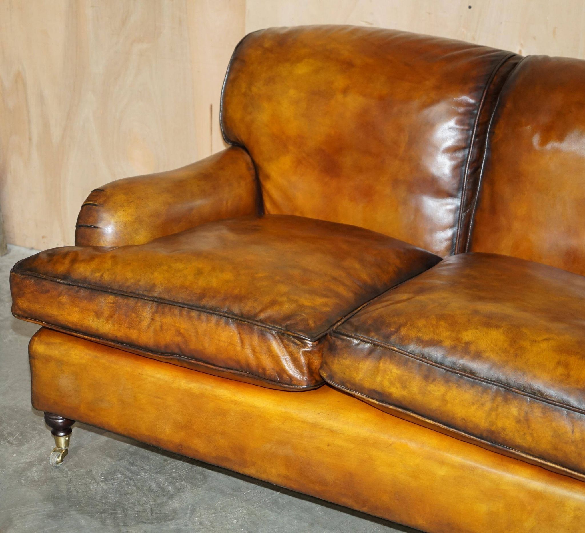 Howard & Son restored leather canapé, width 145 cm