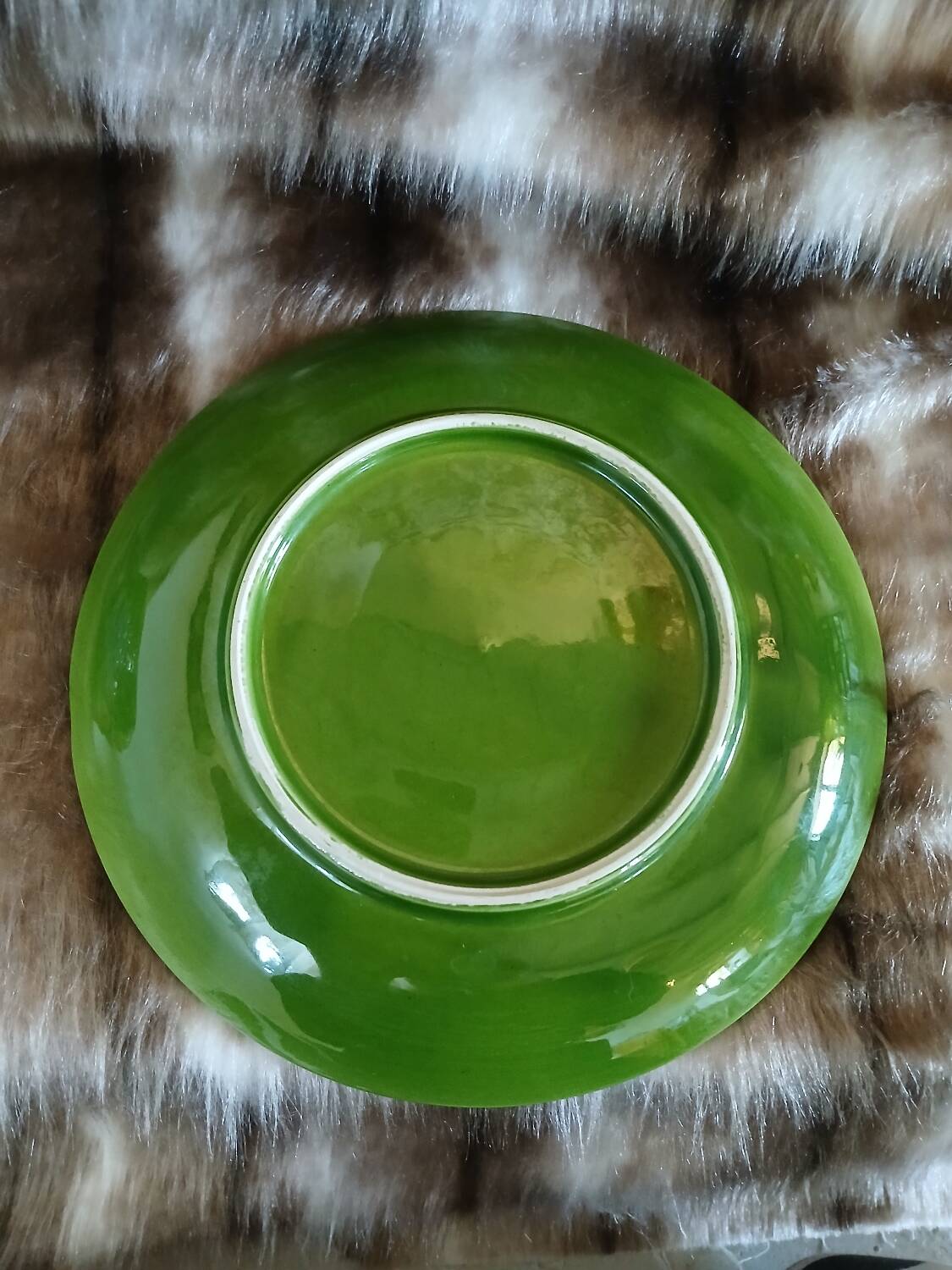 Antique cup and saucer in slipware.