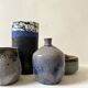 Glazed ceramic vase with a narrow neck and signed, unique piece.
