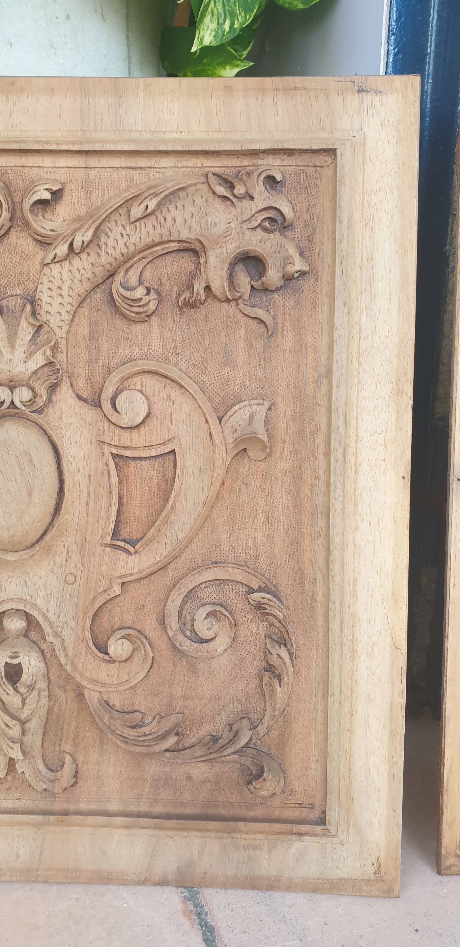 Pair of antique carved walnut panels