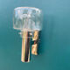 Wall lamp in stainless steel and globe in transparent glass