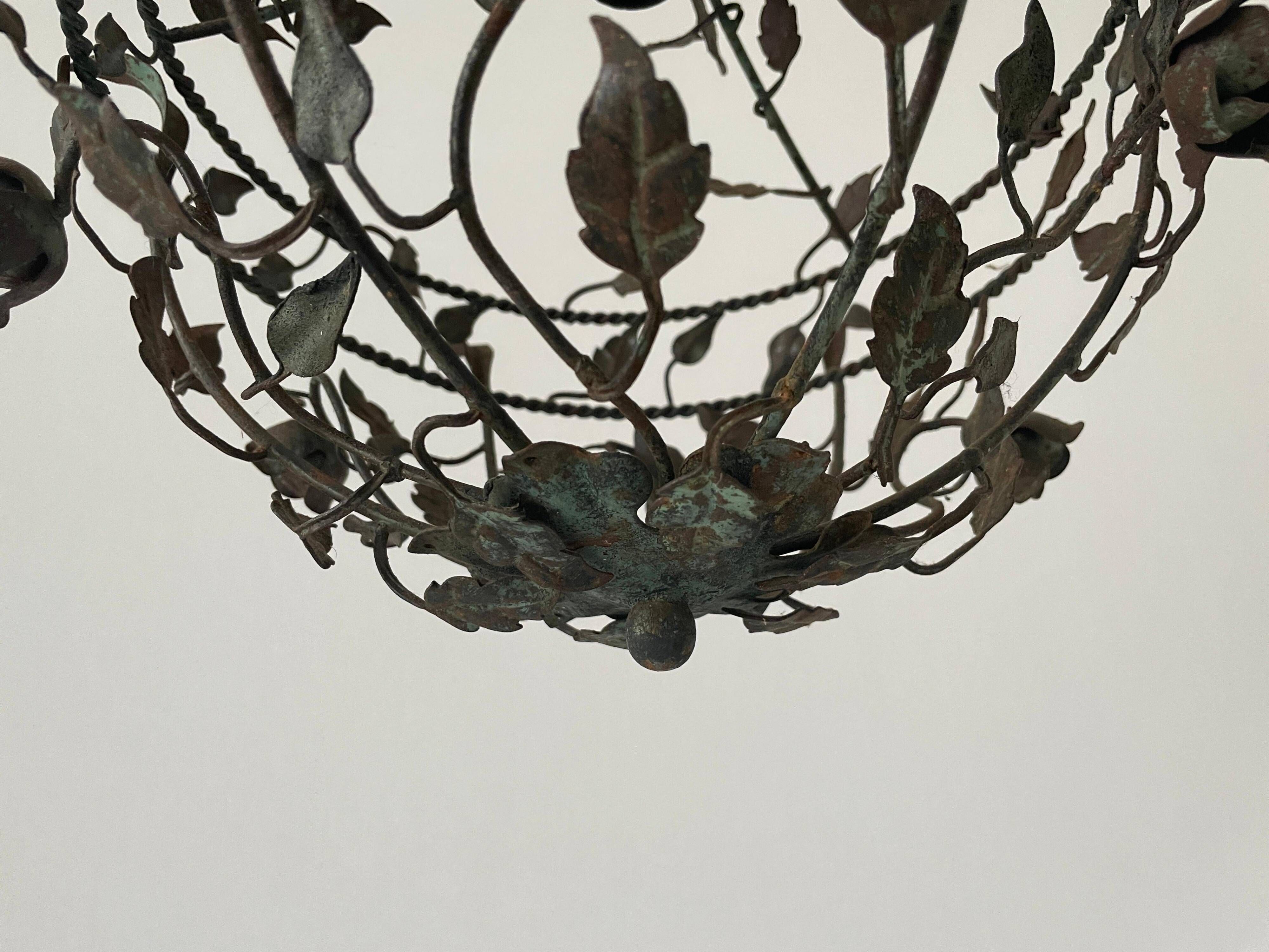 Patinated metal ceiling light with a floral and leaf pattern, 1950s, Italy.