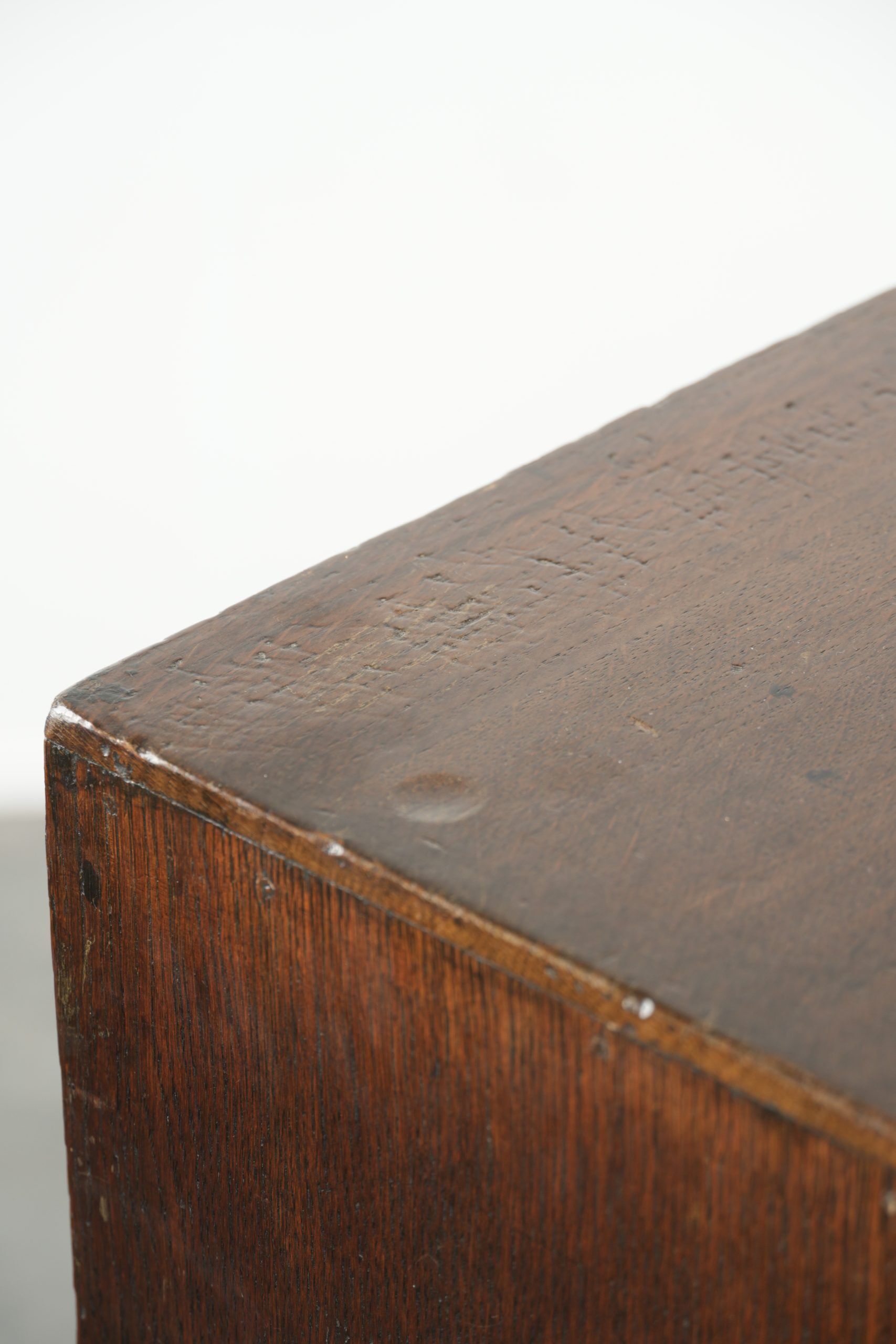 Antique English oak secretary from the 18th century with a stepped interior
