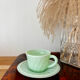 Ancienne tasse et sa soucoupe en opaline vert menthe