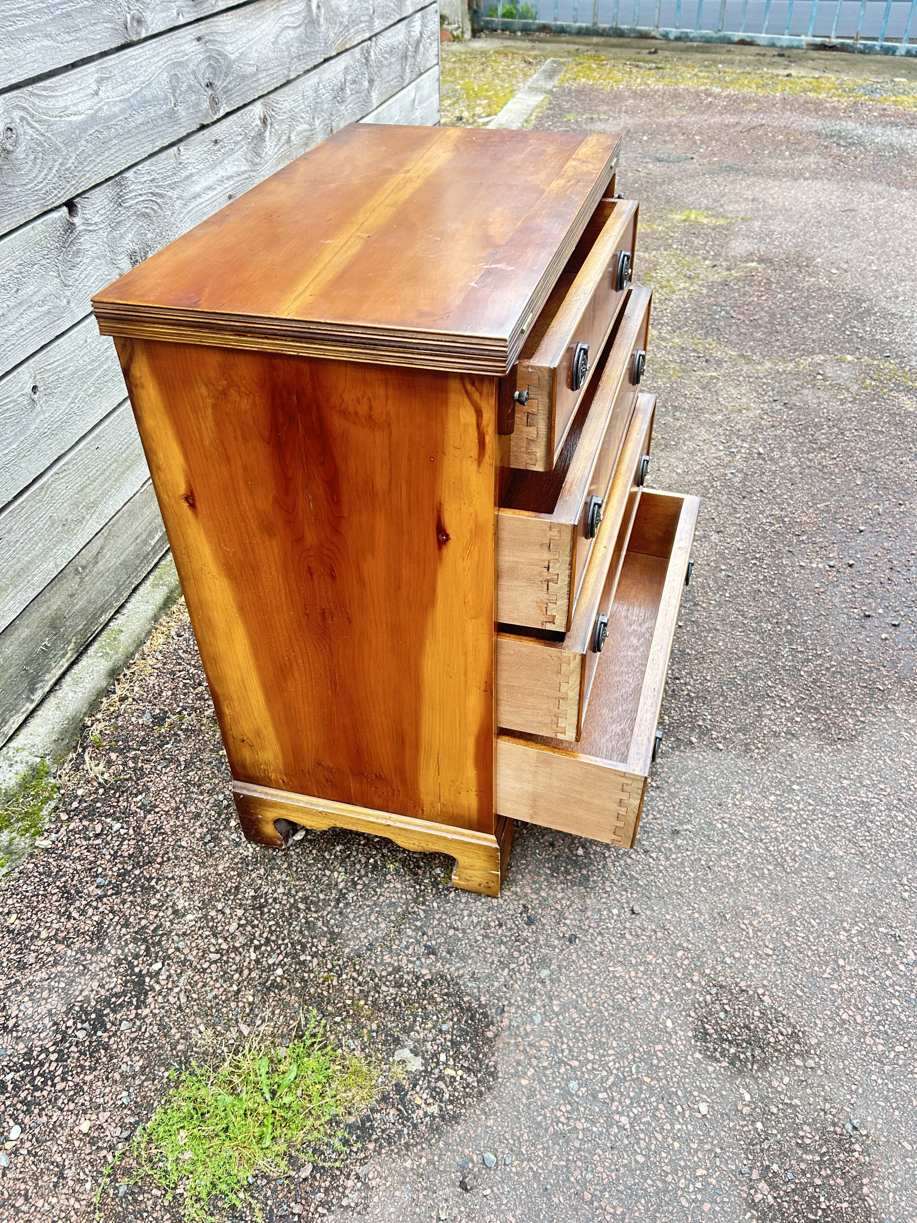 Small English chest of drawers with a folding top.