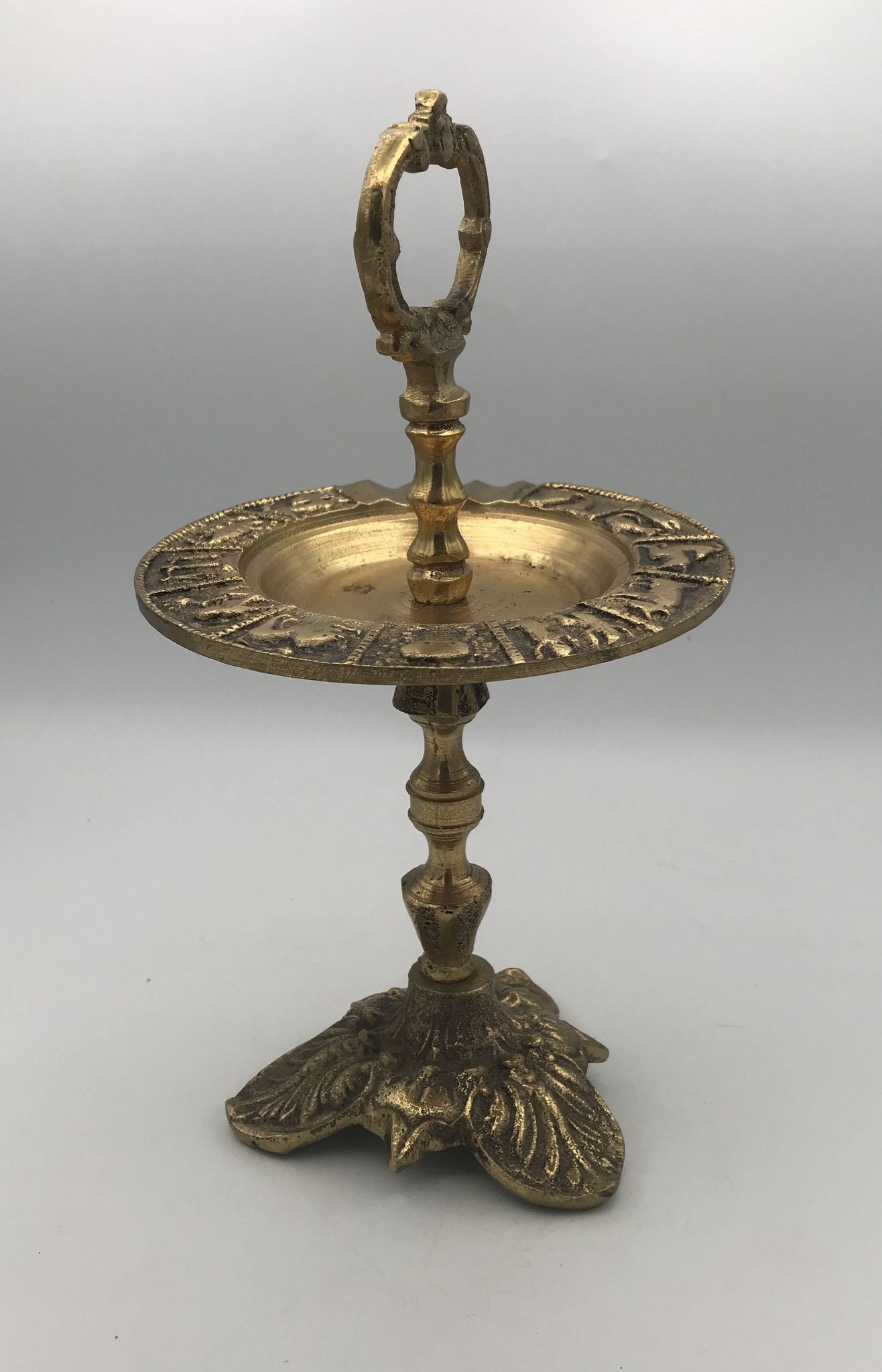 Vintage solid brass ashtray with zodiac sign decor