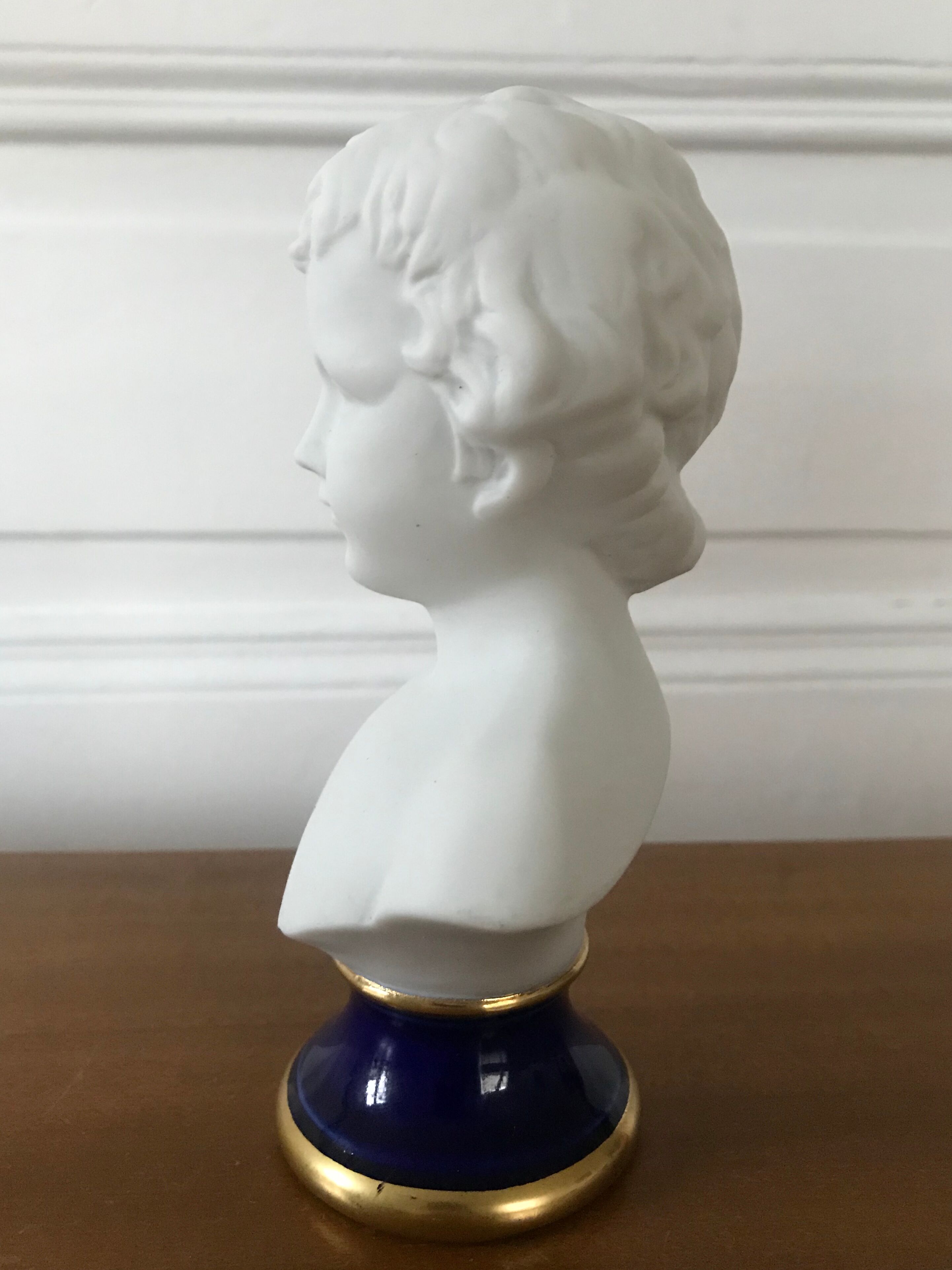 Ancient statuette bust in biscuit