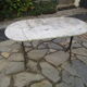 Antique marble bistro table and cast iron foot
