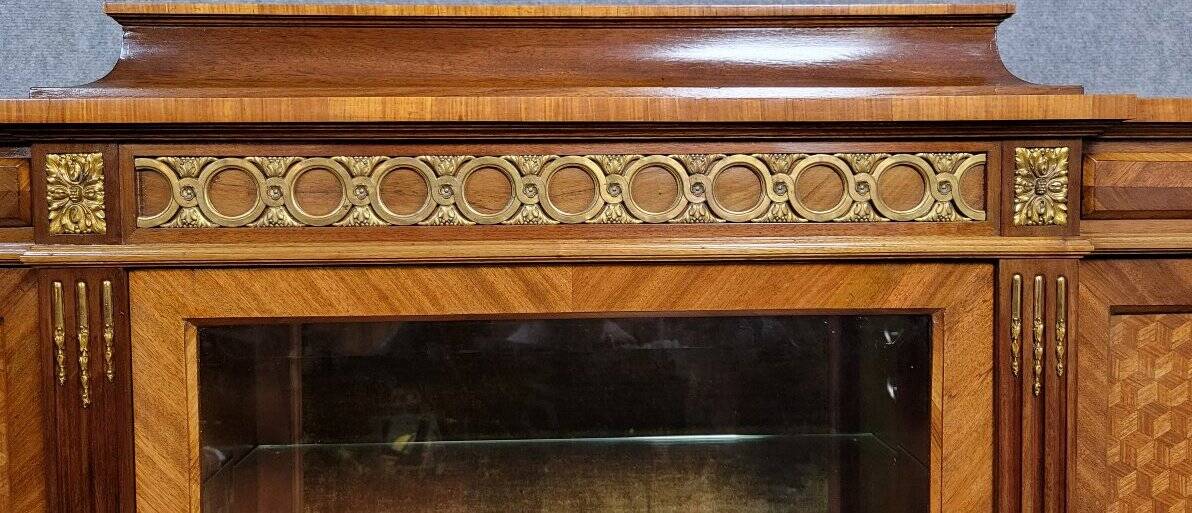 Important showcase library in fine wood and marquetry, stamped.