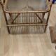 Rattan and frosted glass end table with magazine rack