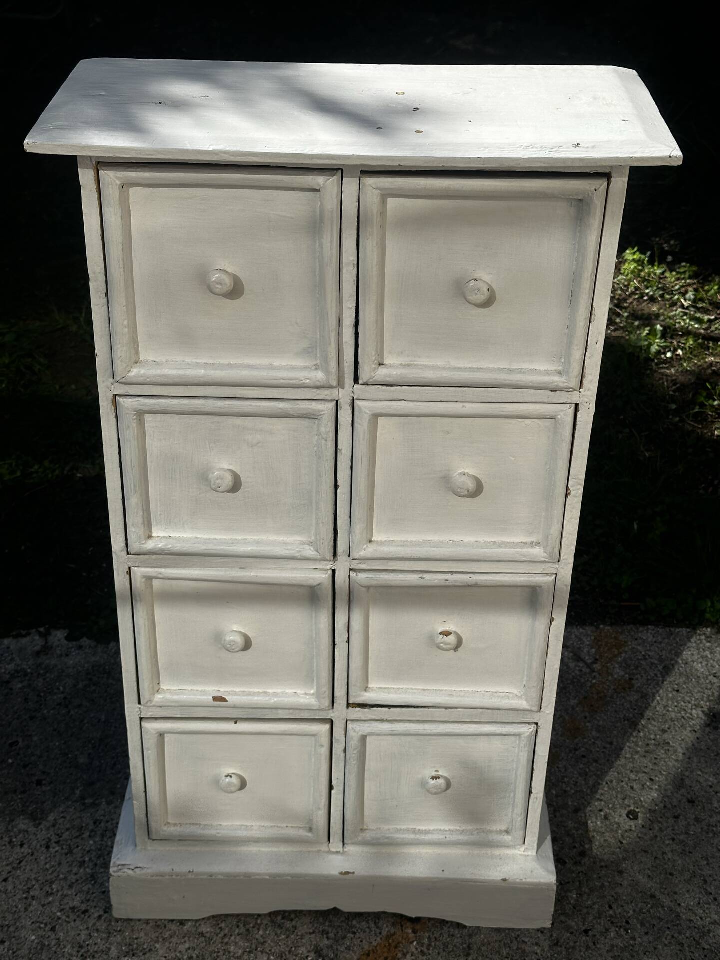 Small antique workshop cabinet with 8 painted wooden drawers.
