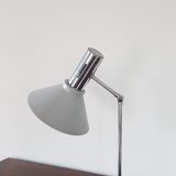 Chrome metal desk lamp and gray articulated arm