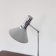 Chrome metal desk lamp and gray articulated arm