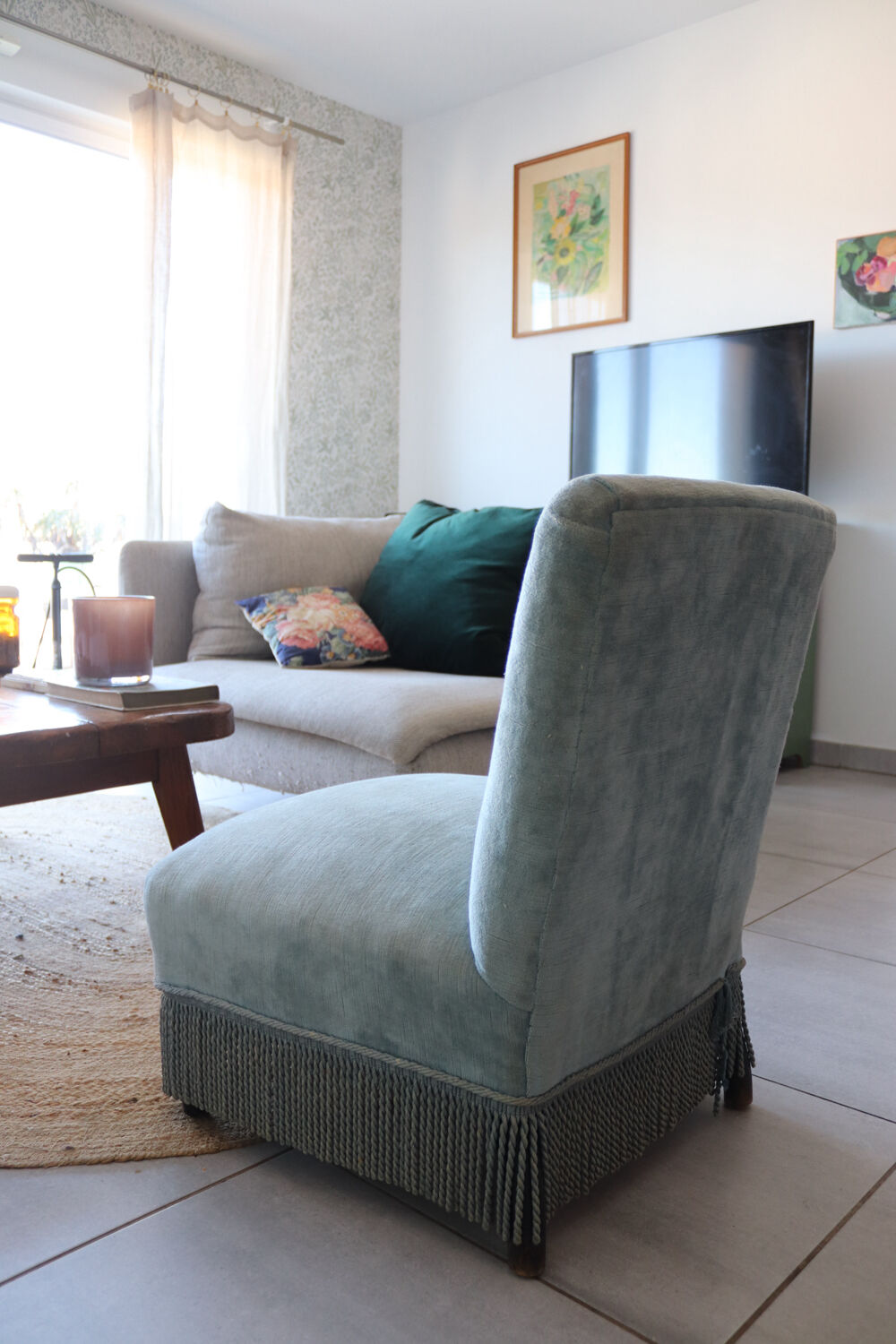Vintage blue velvet fringed armchair.