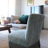 Vintage blue velvet fringed armchair.