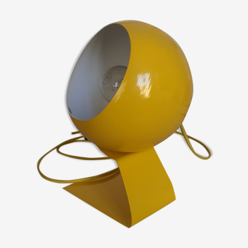Metal ball lamp painted yellow on cotton wire support