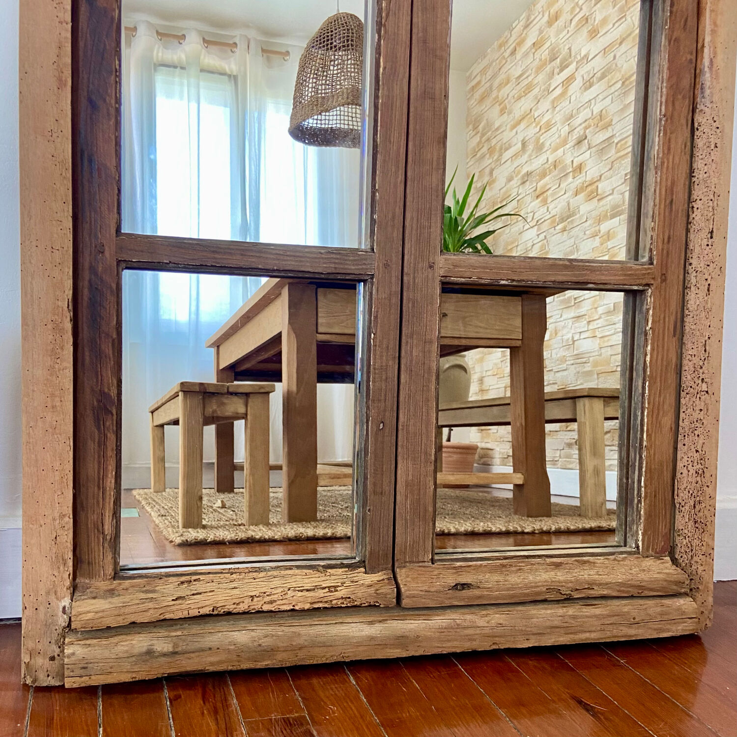 Mirror in old rustic window