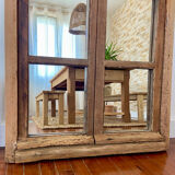 Mirror in old rustic window