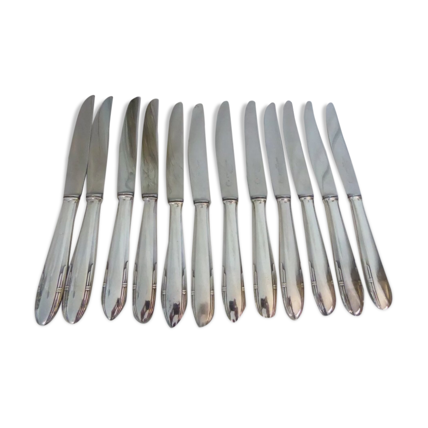 12 silver metal knives