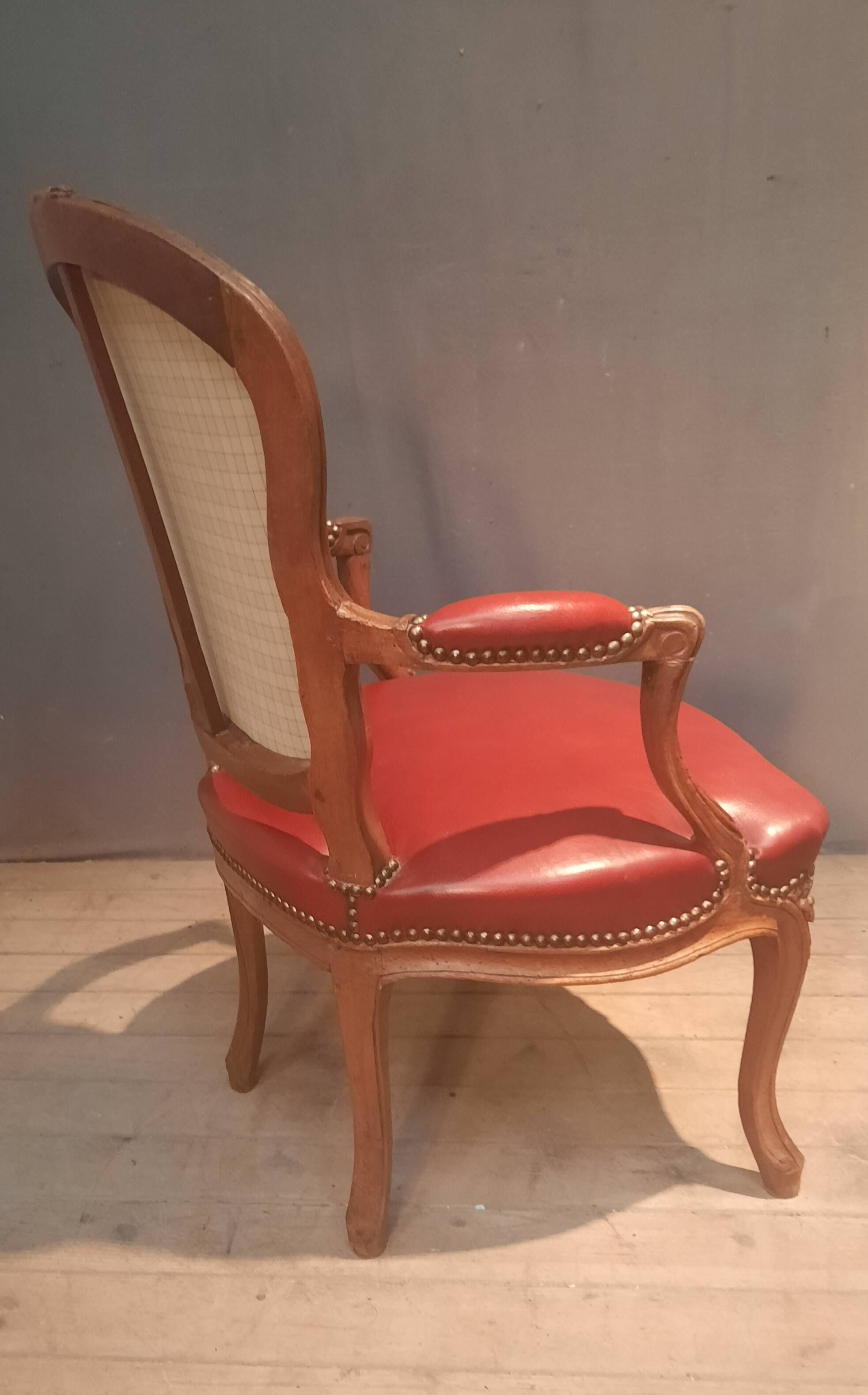 Louis XV period armchair covered in leather.