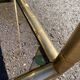 Square faux bamboo pedestal table in gold-plated brass and glass