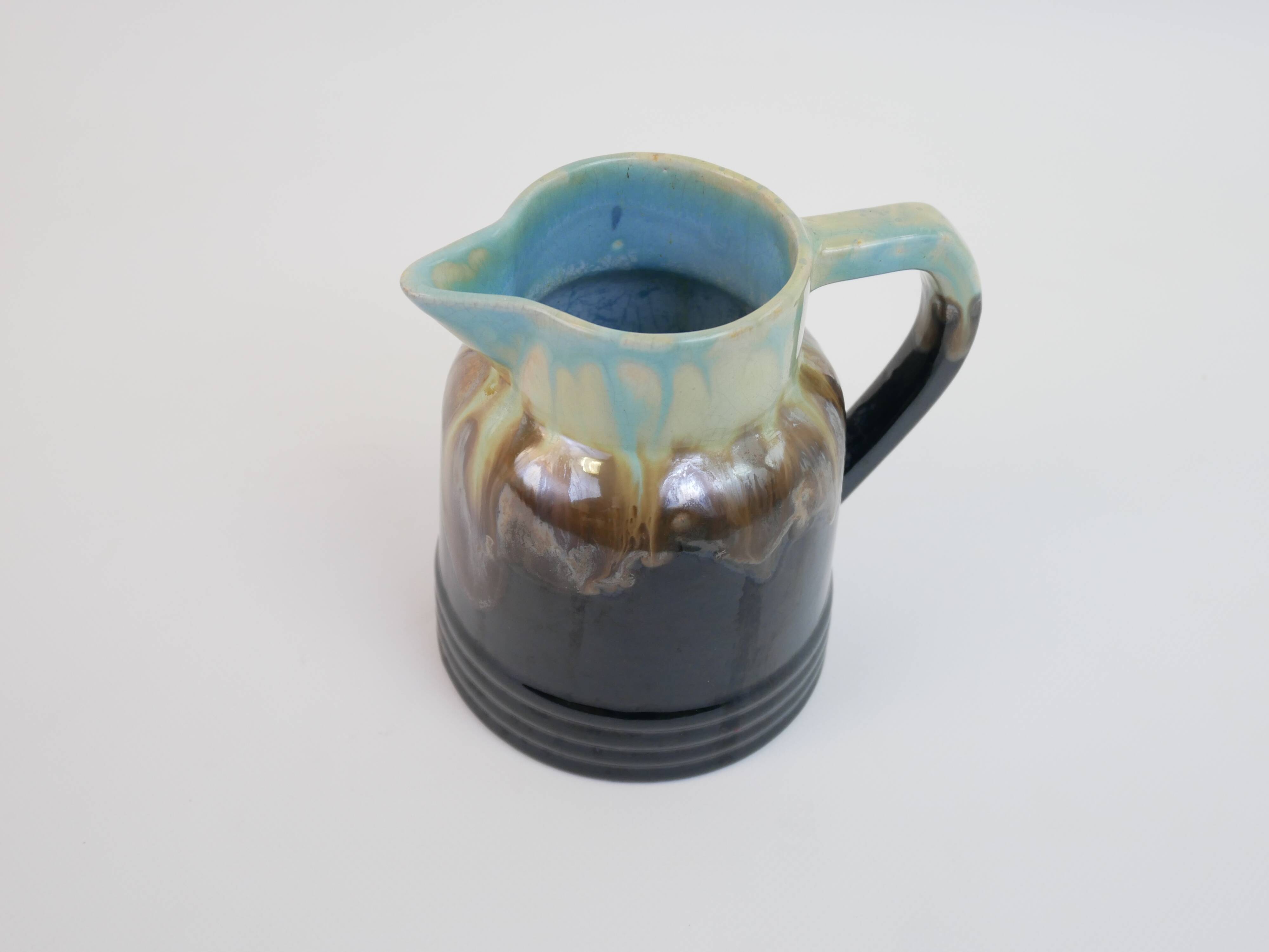 Art Deco pitcher in black, brown and blue glazed ceramic