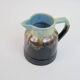 Art Deco pitcher in black, brown and blue glazed ceramic