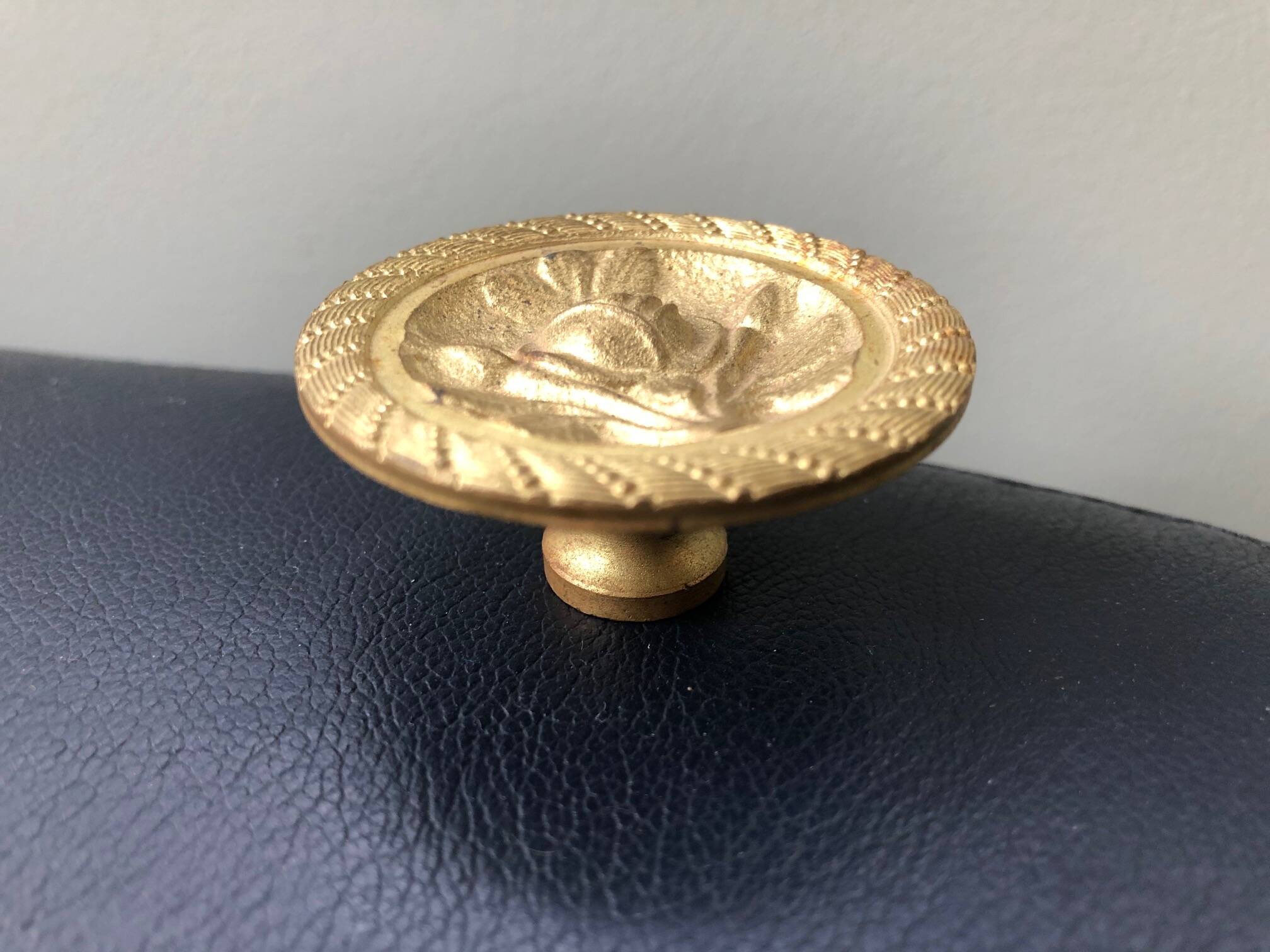 Large solid brass handle knob for door or furniture.
