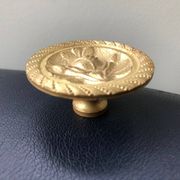 Large solid brass handle knob for door or furniture.