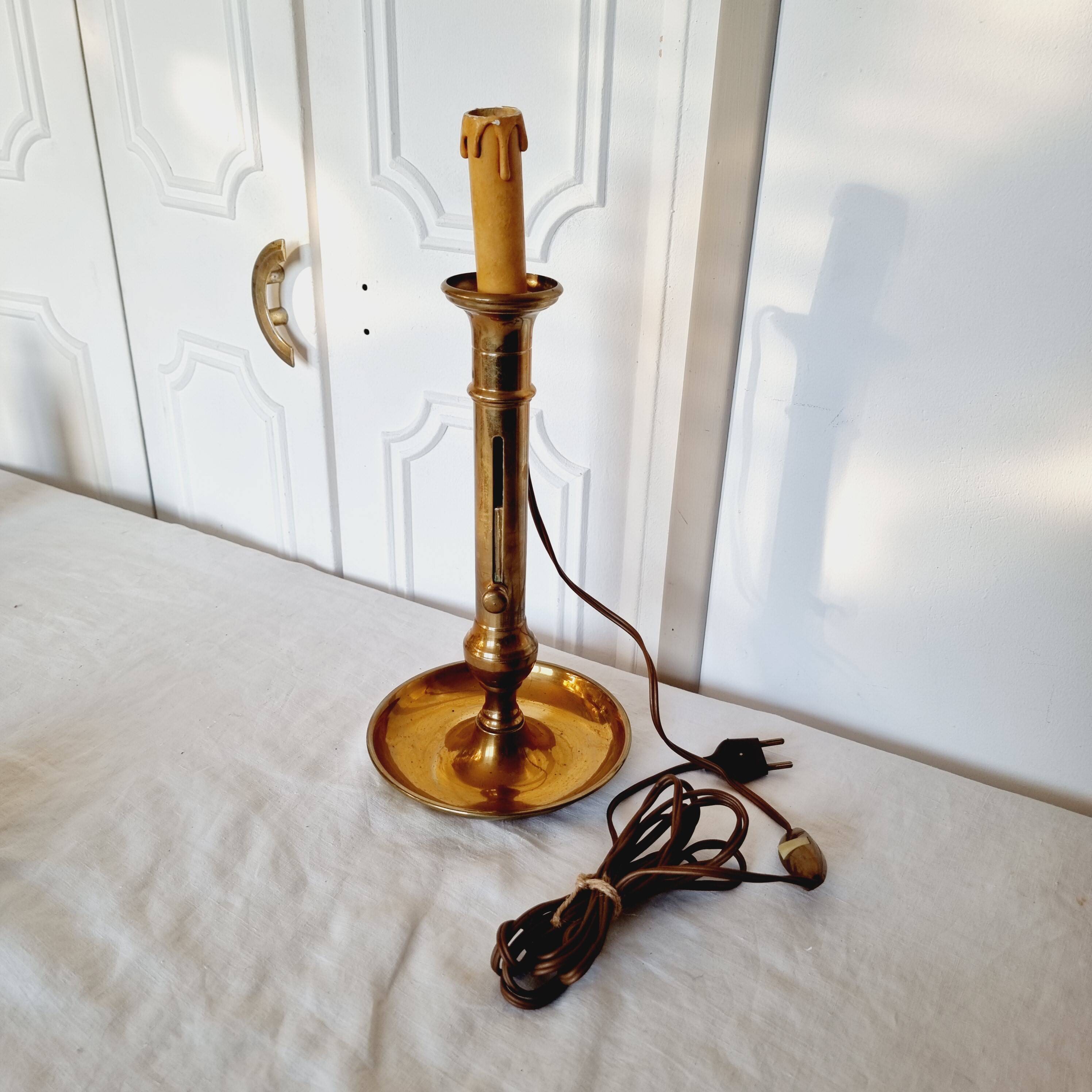 Brass table lamp made from an antique 19th century candlestick or candle holder.