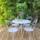 Renovated round table and garden armchairs