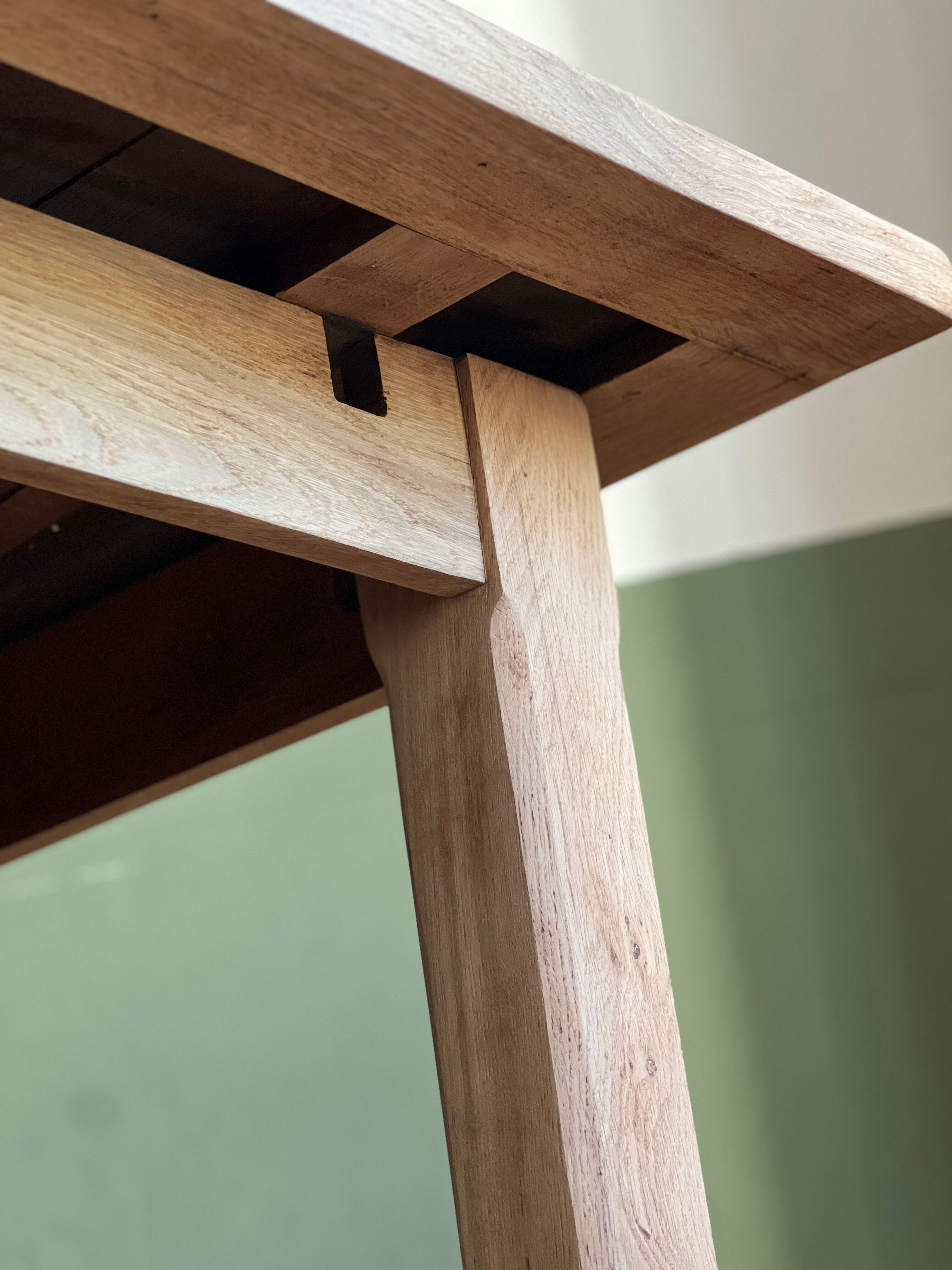Farm table made of solid light oak wood.