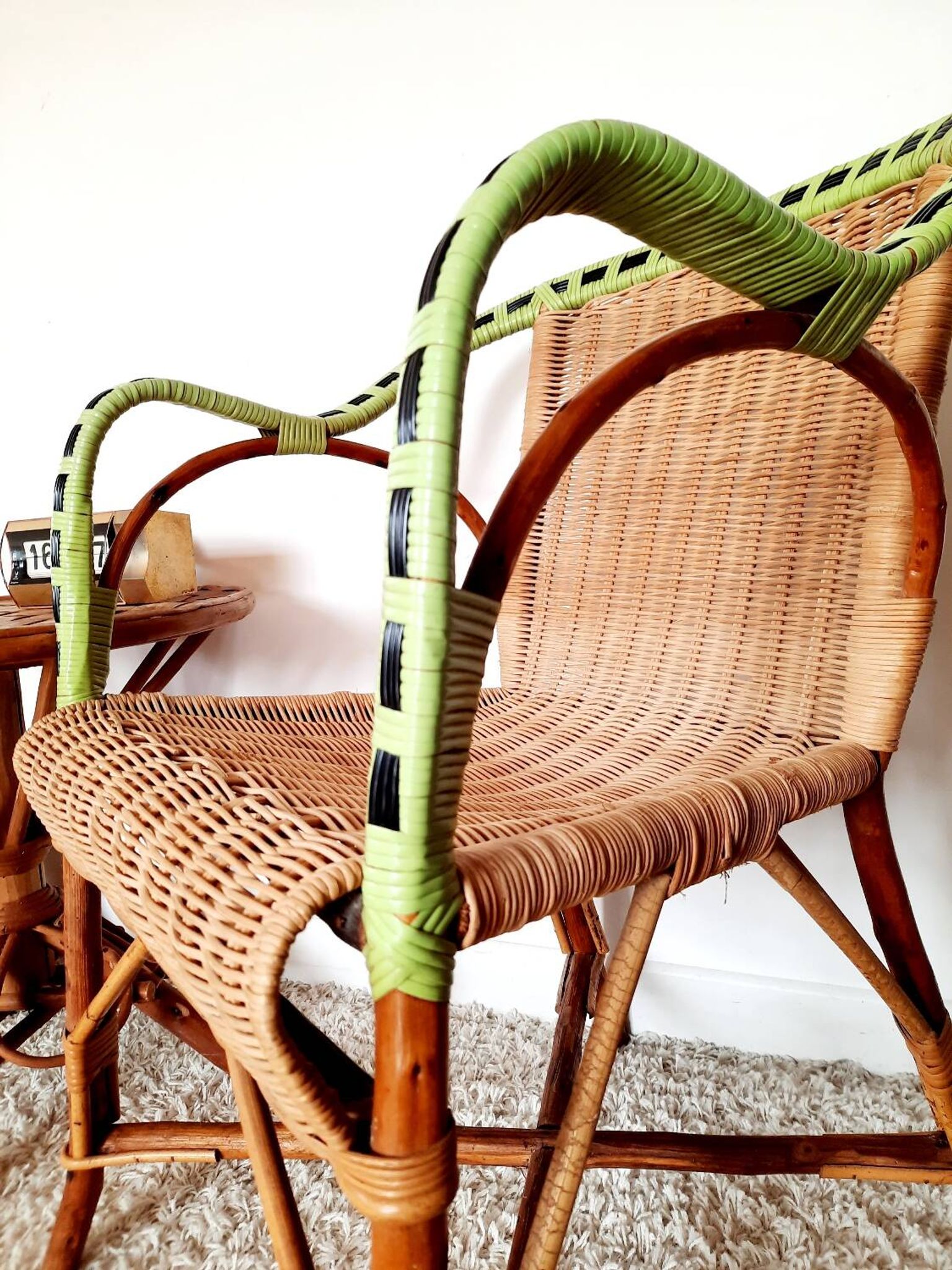 1950s 60s rattan armchair with green apple and black piping.