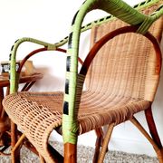 1950s 60s rattan armchair with green apple and black piping.