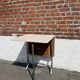 Folding table with chrome and pink formica.