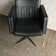 Black swivel club armchair in faux leather with golden metal base, Czechoslovakia 1960s.