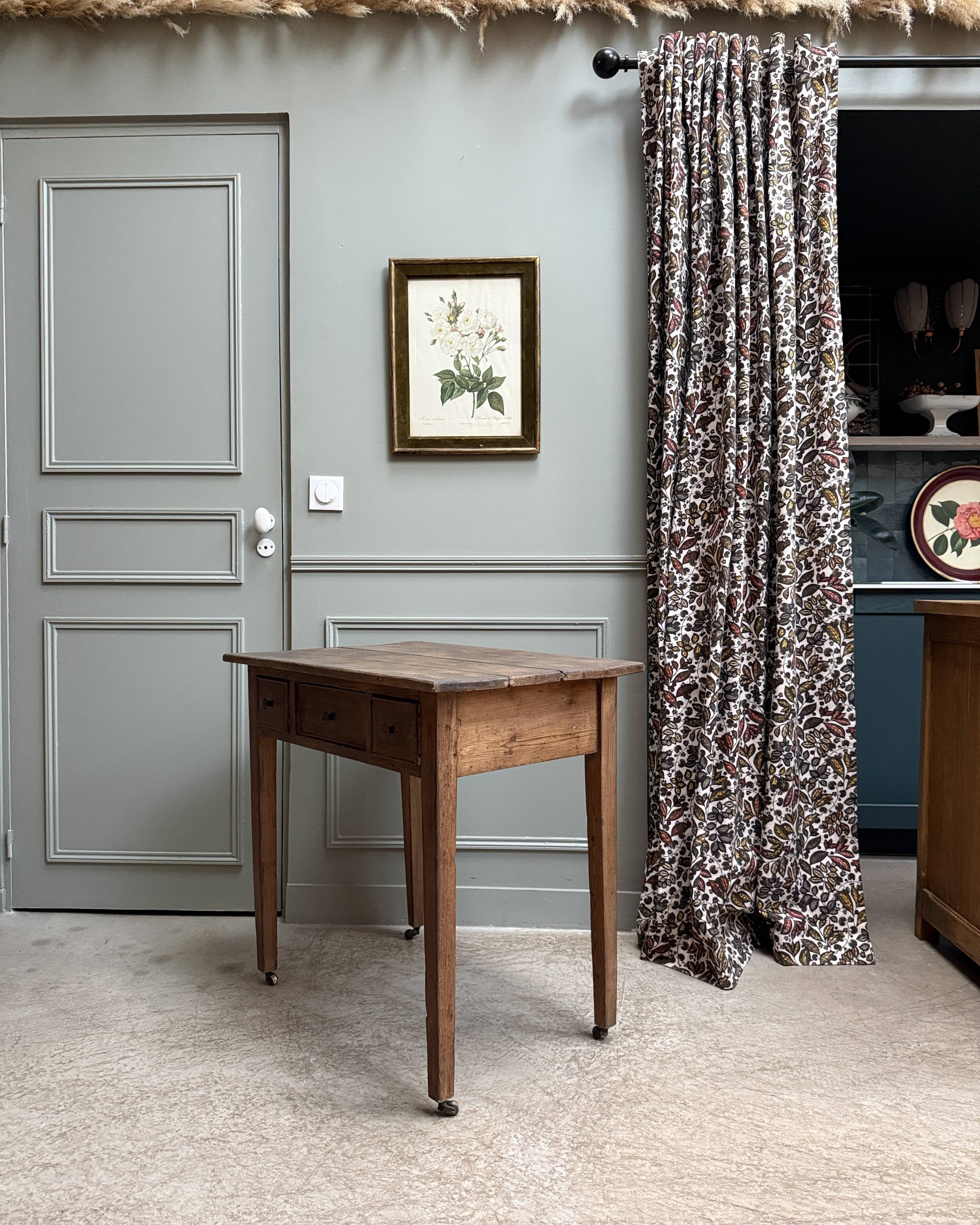 Small antique desk on wheels