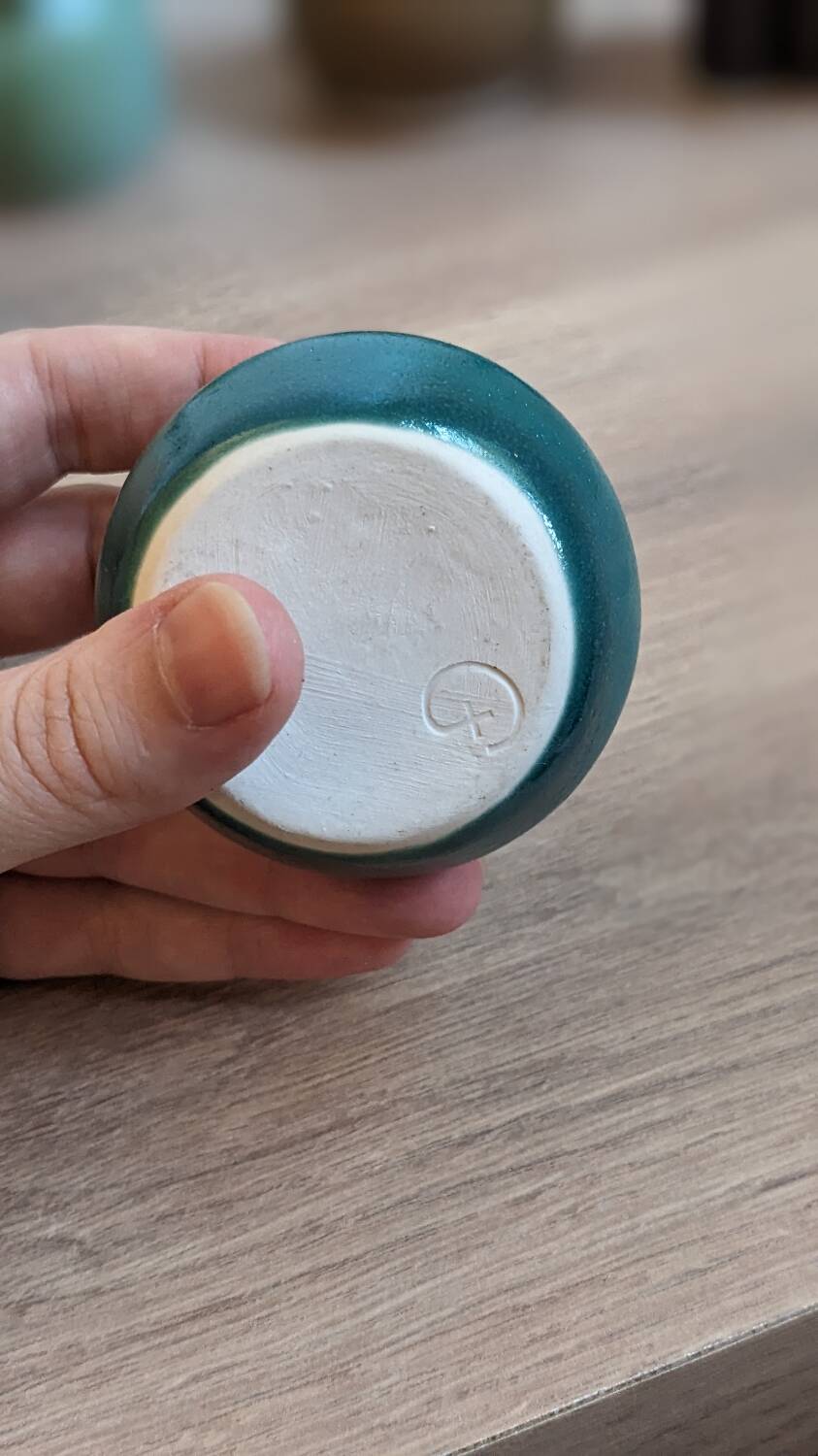 Small handmade turquoise pottery.